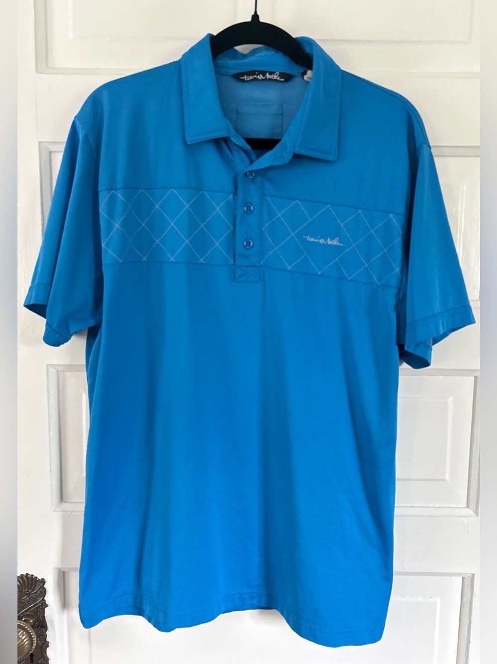 Travis Mathew Men's Blue Polo with Subtle Diamond Chest Detail. Size Large
